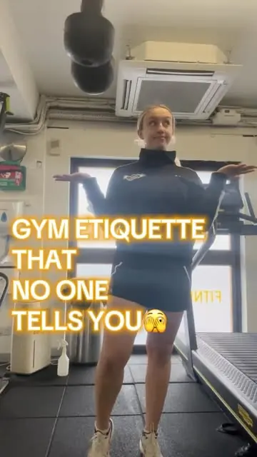 A member on the gym floor holding a Three Sixty Fitness towel
