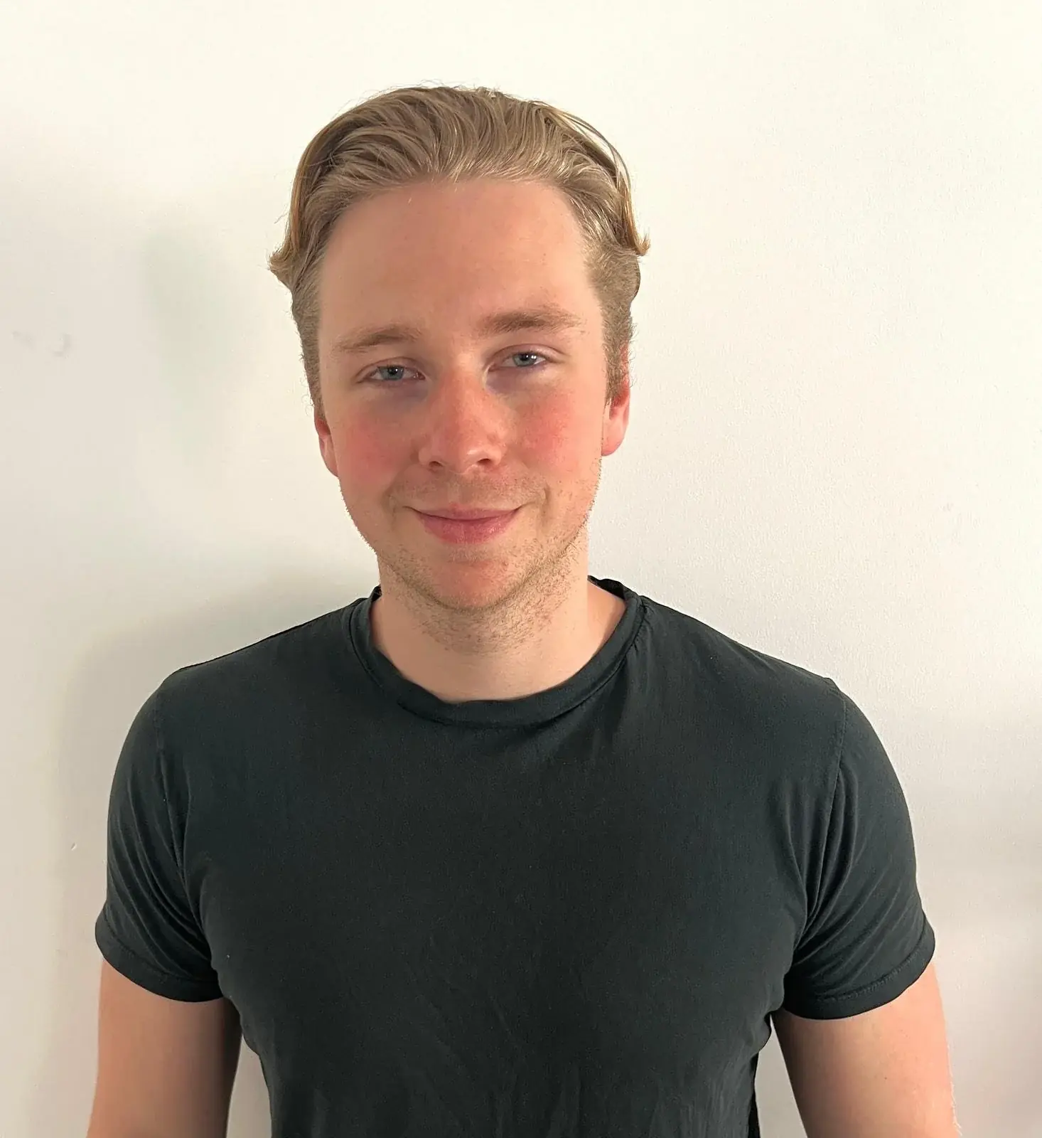 A personal trainer photographed against a plain background